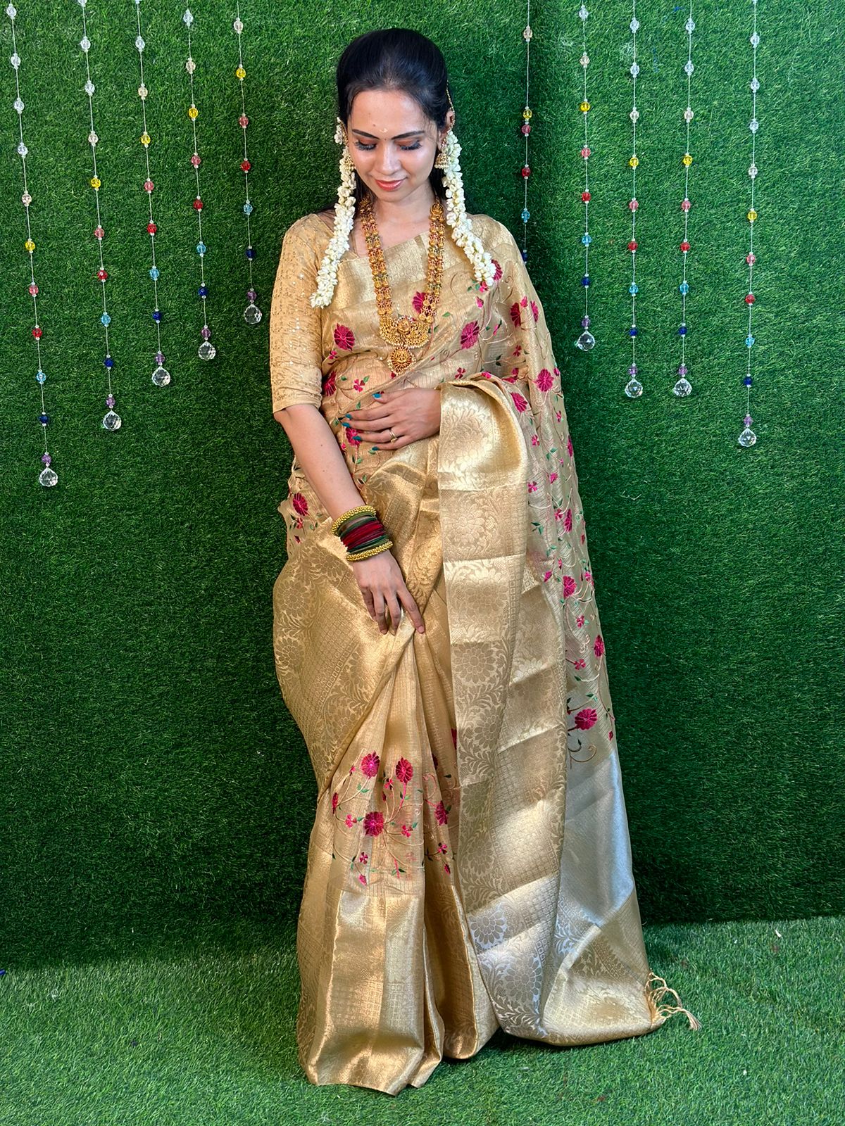 Golden tissue saree.