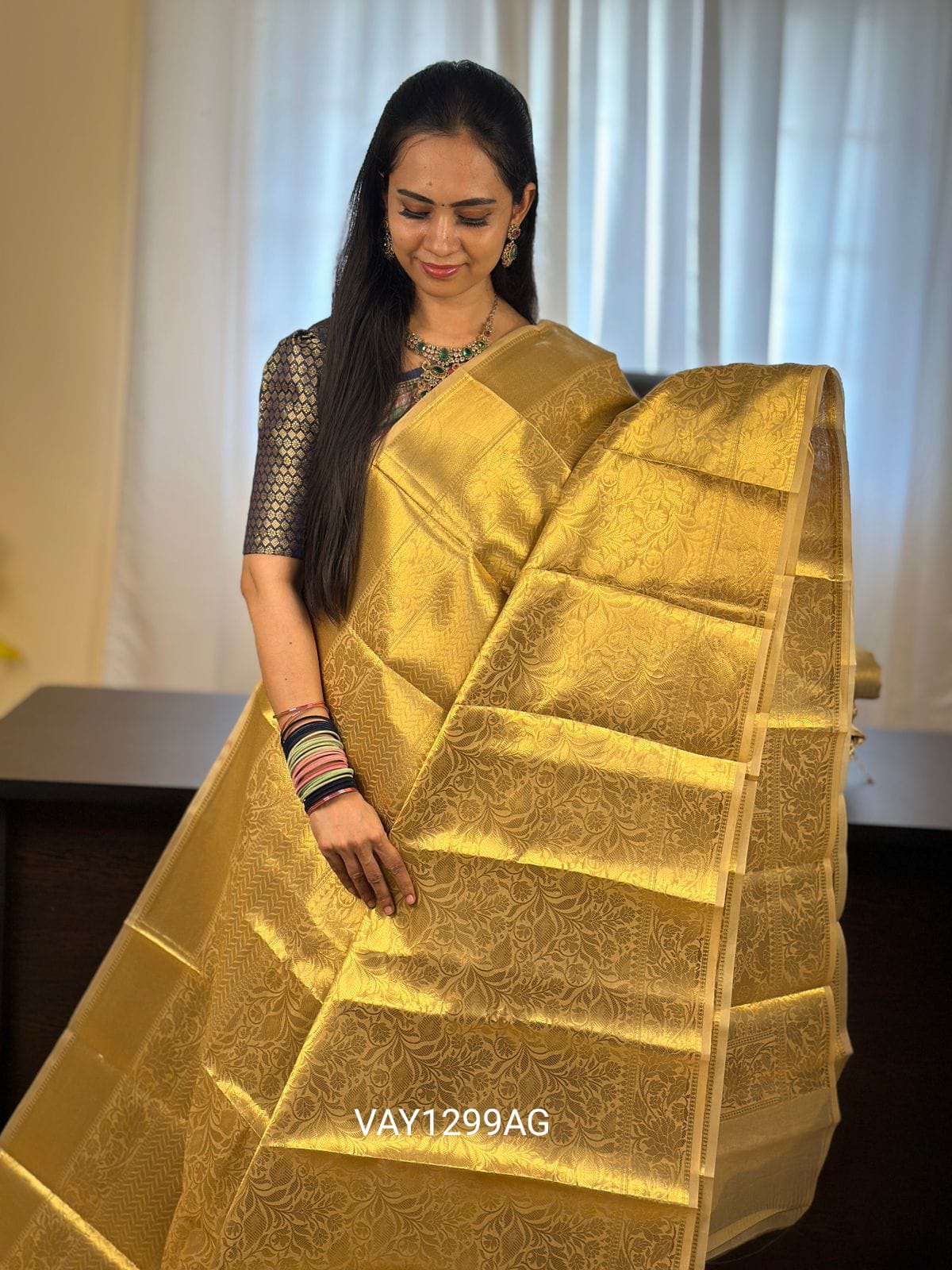 Golden tissue saree.YYY