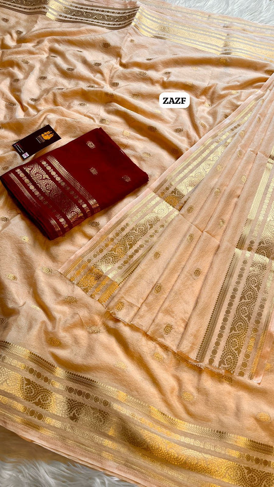 Fabric - Viscos Georgette hand dyed gold zari weaving saree with allover zari butta 
Blouse - Contrast blouse🥳